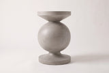 The Raffadali side table seen straight from the side: a round top disc over a concave cone, a full sphere, a slim neck and a round foot disc