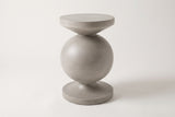 The Raffadali light grey concrete sphere pedestal side table, three-quarter view on a light studio backdrop