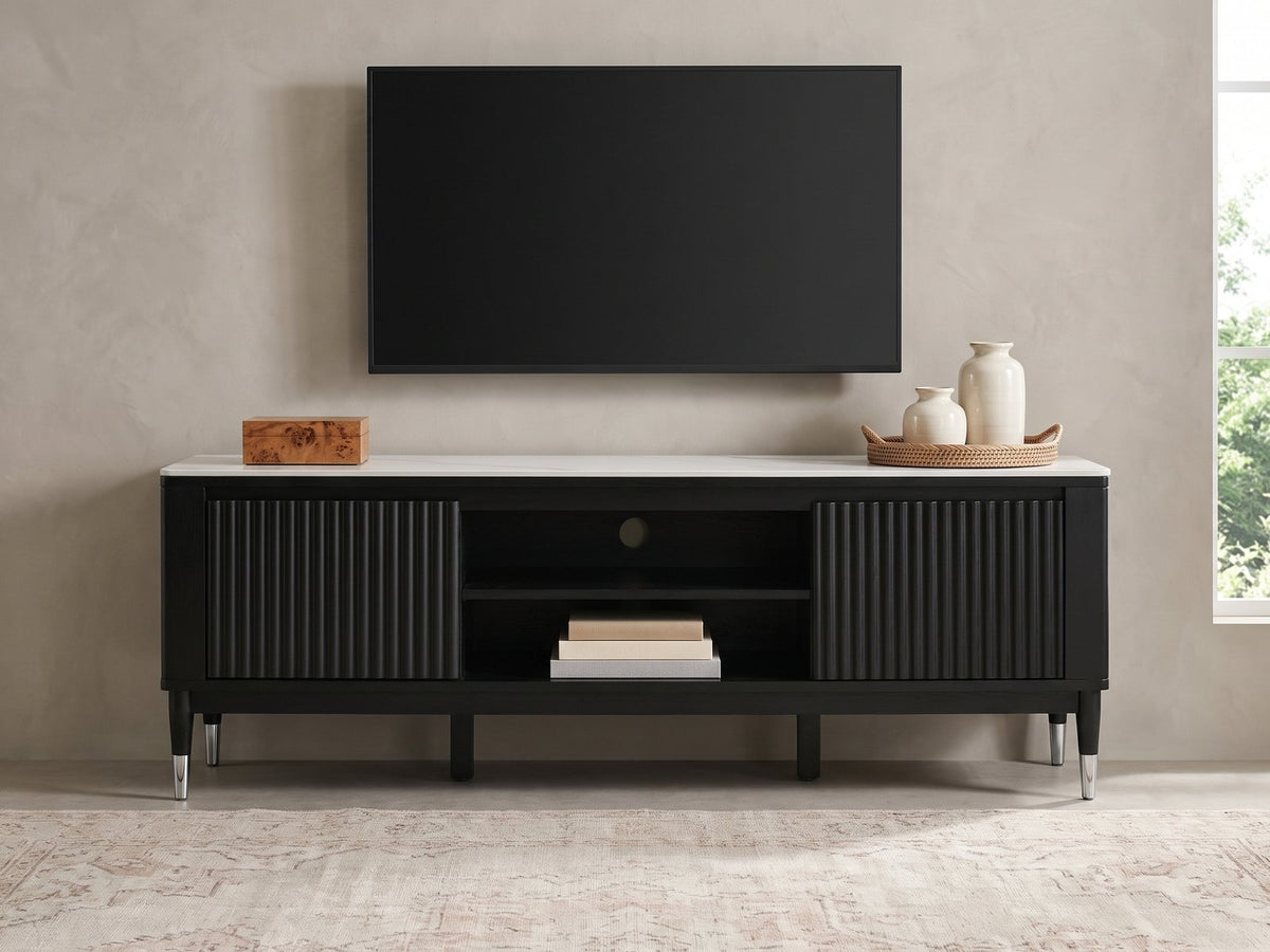 Ragusa Stone Top Media Console styled with a box, a tray of vases and books under a wall-mounted screen