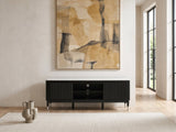 Ragusa Stone Top Media Console under a large abstract painting in a bright living room