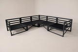 The five black metal frames of the Randazzo sectional without covers, pushed together into an L, with rail backs, cross braces and seat decks