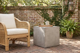 Realmonte concrete cube side table with a teapot on a wooden tray in a Savannah walled garden, an old brick wall with creeping fig and a herringbone brick floor (chair and decor not included)