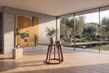 Riace 47-Inch Round Solid American Walnut Dining Table in a sunlit villa dining room