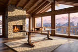 Ricadi 72-Inch Rectangular Reclaimed Pine Trestle Dining Table in an alpine chalet