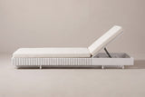 The Riesi chaise lounge seen from the side: ribbed seat section on the left, the plain head box and raised back on the right