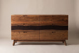 The Rionero sideboard in amber-brown acacia, front view on a light studio backdrop