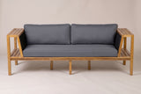 The Riposto daybed sofa seen from the front: two box arms, rope panels leaning outward, one long seat cushion and two back pillows
