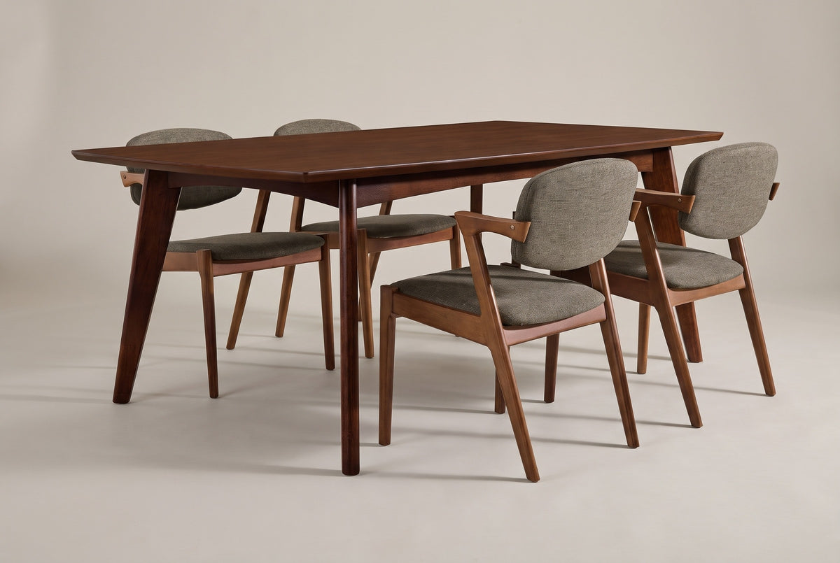 The Rossano dining set in three-quarter view: one walnut-veneer table and four demi-arm chairs upholstered in grey-brown woven fabric, on a light studio backdrop