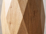 Close-up of the Rotondella Faceted Mango Drum Side Table: the flat facets meeting at the widest ridge of the drum