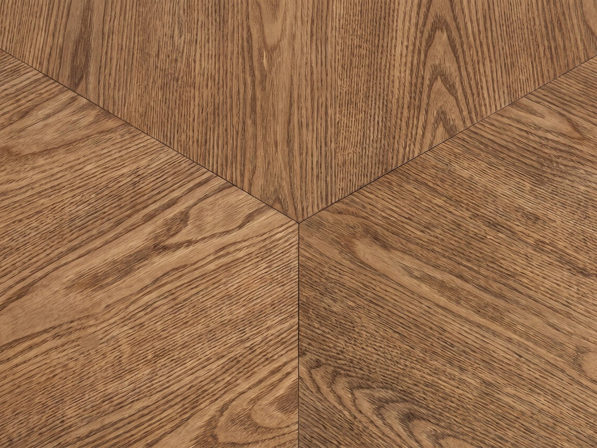 Close-up of the Rovereto Brown Ash Veneer Round Coffee Table: the three-way matched ash veneer at the centre of the top