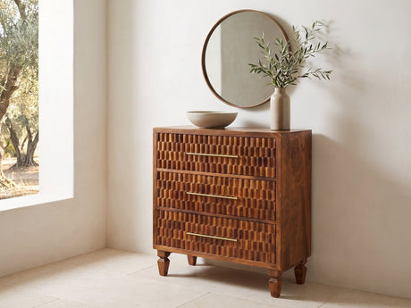 Rovigo 33-Inch Chestnut Carved Mango 3-Drawer Chest under a round bronze mirror in a villa bedroom