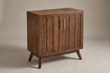 The Ruvo accent cabinet in a walnut finish with two doors, six raised panels and two brass-tone pulls, three-quarter view on a light studio backdrop