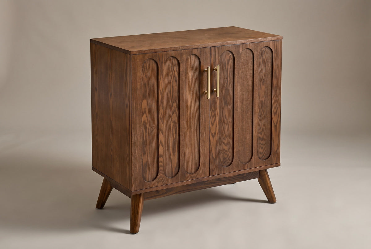 The Ruvo accent cabinet in a walnut finish with two doors, six raised panels and two brass-tone pulls, three-quarter view on a light studio backdrop
