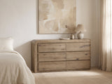 Sacile 70-Inch Weathered Natural Oak 6-Drawer Dresser against a plaster wall under an abstract canvas in a bright bedroom