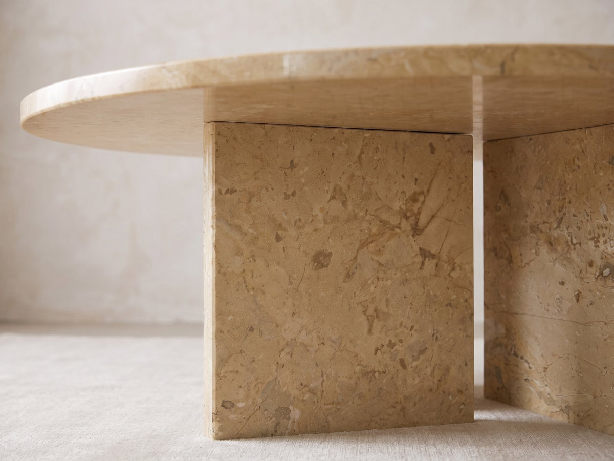 Close-up of the Salina Gold Beige Marble Coffee Table: the two gold beige marble slabs of the base meeting under the top