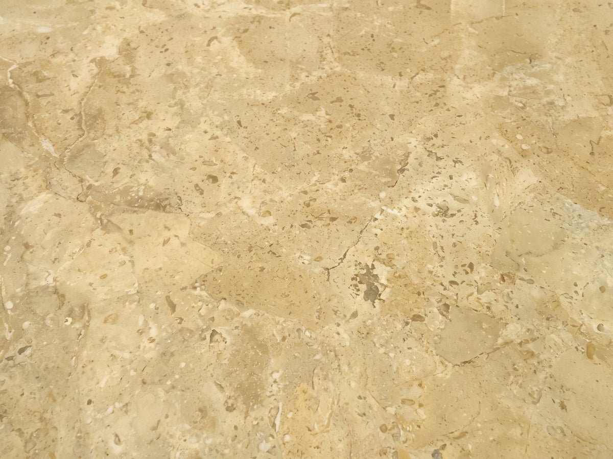 Close-up of the Salina Gold Beige Marble Coffee Table: the veining of the polished gold beige marble top