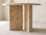 Close-up of the Salina Gold Beige Marble Round Side Table: the two gold beige marble slabs of the base set in a T under the top