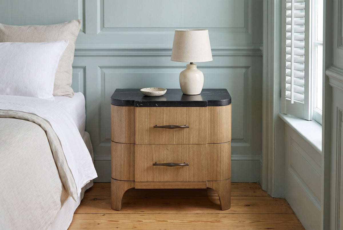 Samassi eucalyptus nightstand against pale duck-egg wall panelling in a Charleston bedroom with heart-pine floors