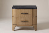 The Samassi nightstand in honey-tan eucalyptus with a black stone top, front view on a light studio backdrop