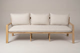 The Sambuca sofa seen straight from the front: one long seat cushion, three back cushions, two slim arms and the square legs