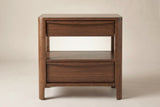 The Sanluri nightstand in walnut veneer, front view on a light studio backdrop