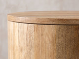 Close-up of the Sansepolcro Natural Mango Drum Side Table: the flush round top over the vertical mango staves of the drum