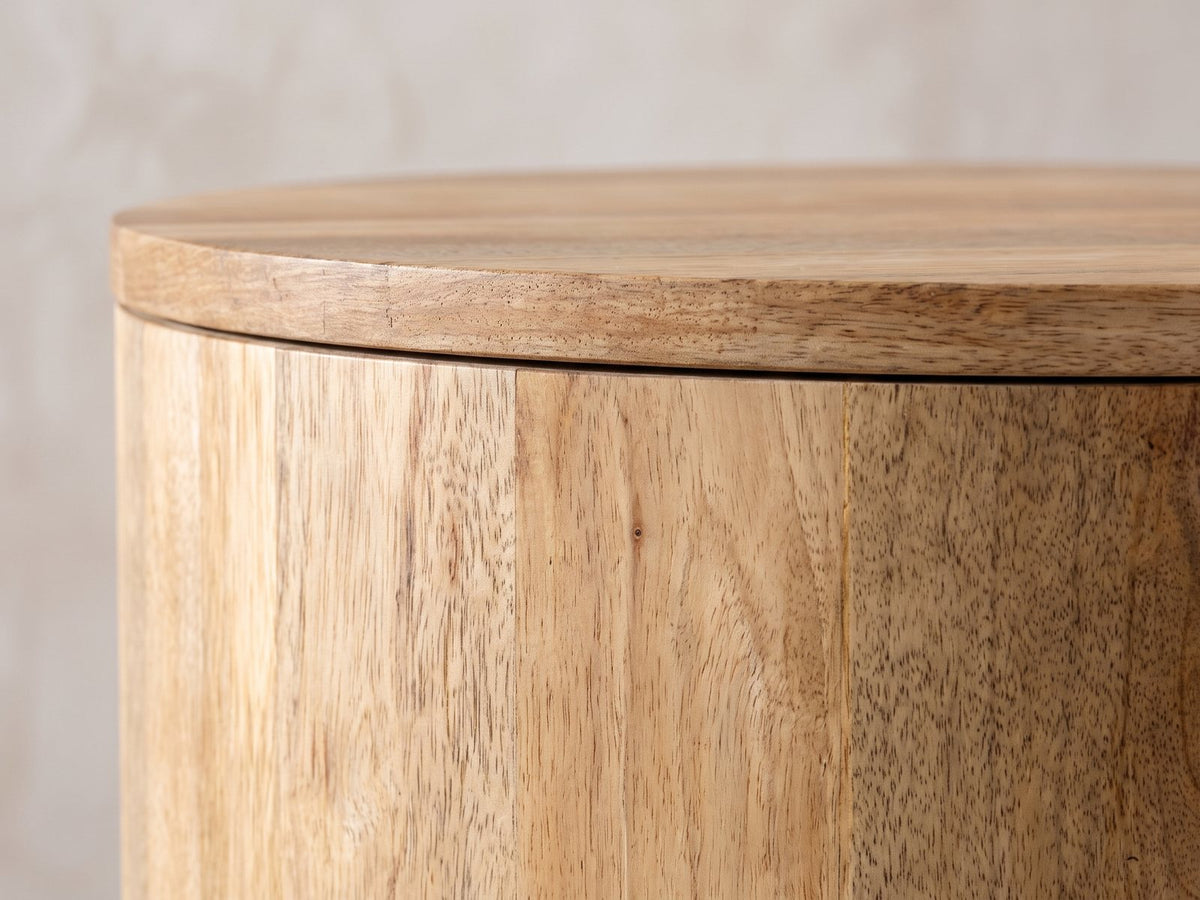 Close-up of the Sansepolcro Natural Mango Drum Side Table: the flush round top over the vertical mango staves of the drum