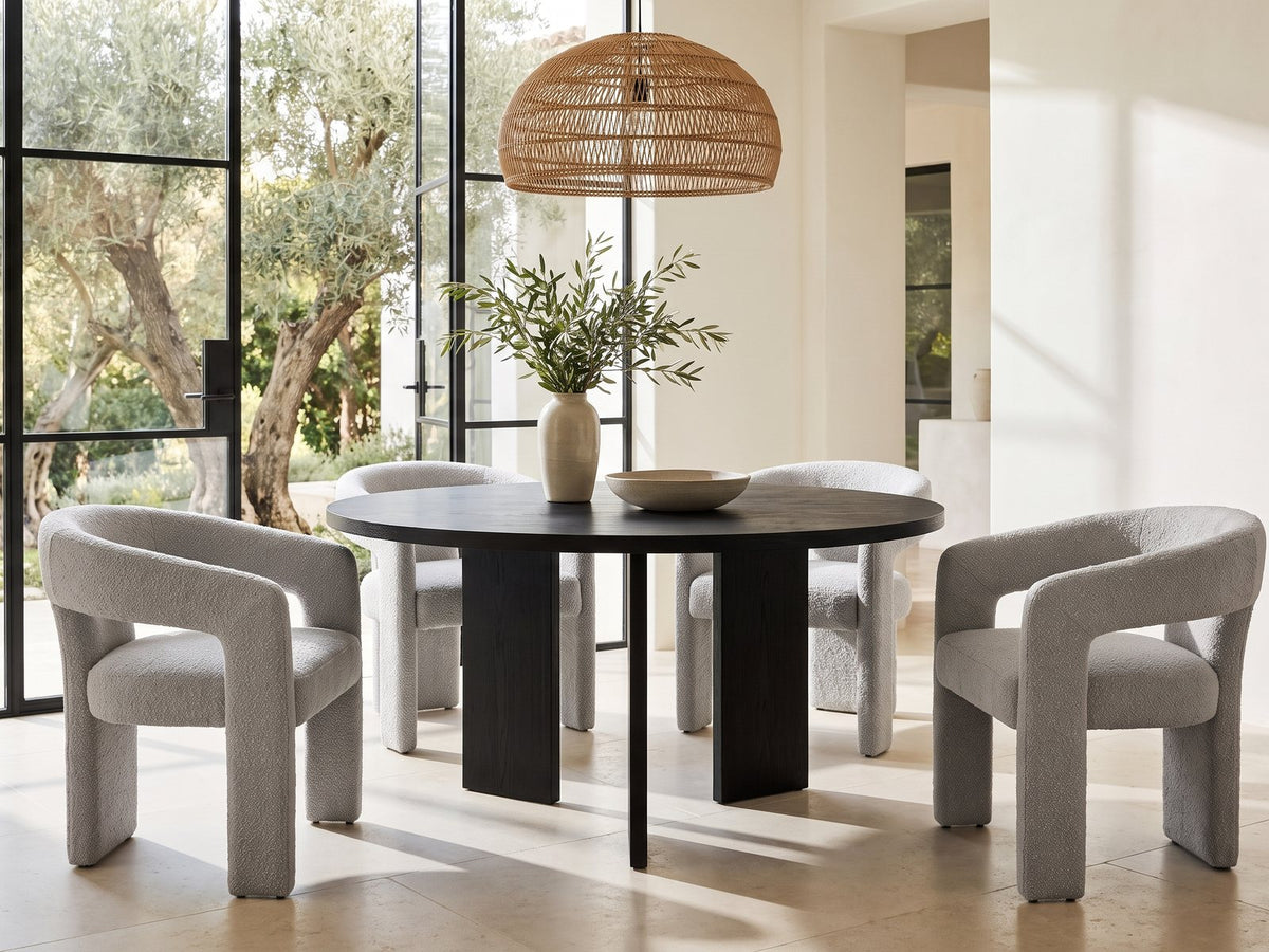 Saracena 54-Inch Round Ebony Oak Dining Set with 4 Boucle Chairs in a sunlit villa dining area with olive trees outside