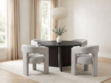 Saracena 54-Inch Round Ebony Oak Dining Set with 4 Boucle Chairs in a bright plaster dining room with linen curtains