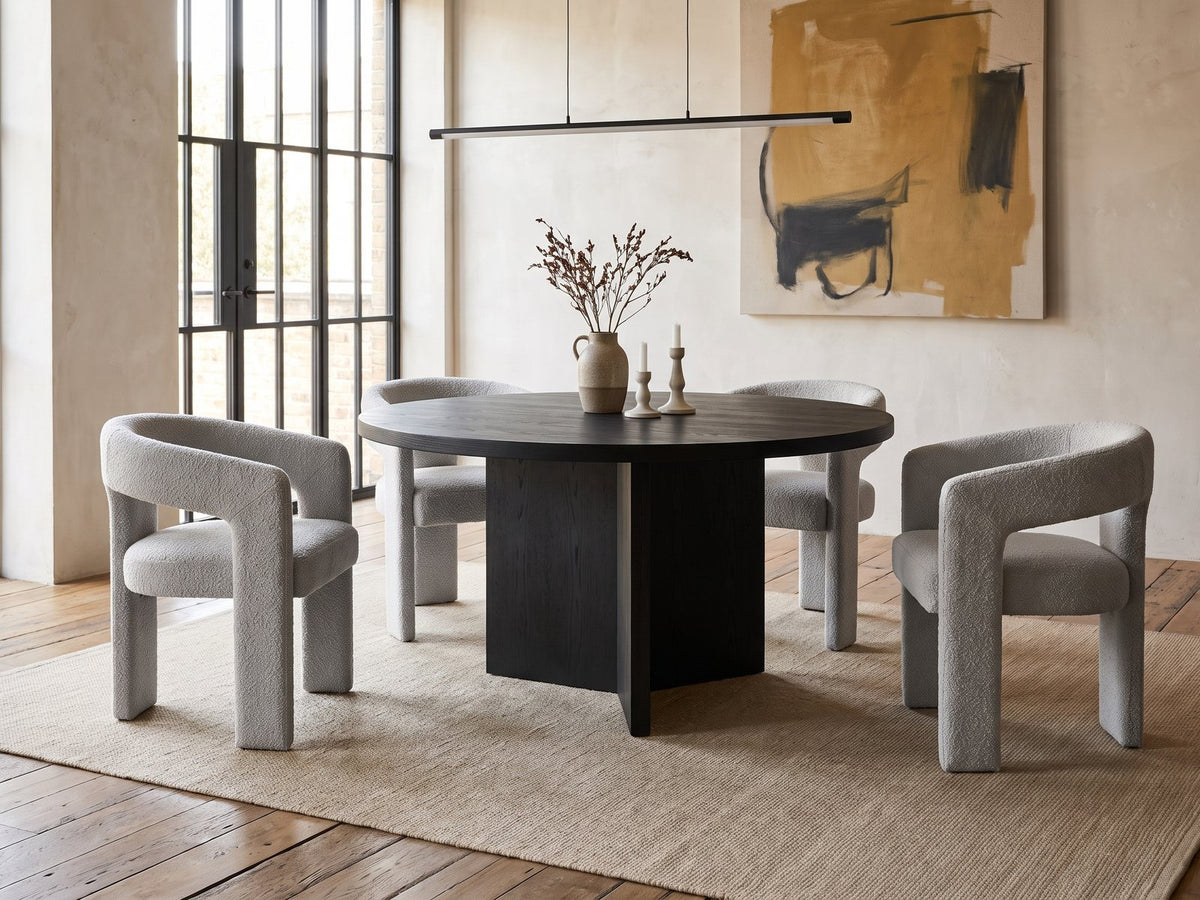 Saracena 54-Inch Round Ebony Oak Dining Set with 4 Boucle Chairs in an industrial loft dining area