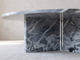 Close-up of the Saturnia Blue-Grey Marble Coffee Table: the two marble slabs of the base meeting under the top