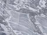 Close-up of the Saturnia Blue-Grey Marble Coffee Table: the veining of the polished blue-grey marble top