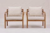 The two Savoca chairs from the front: square legs, deep seat rails and the curved arms on both sides