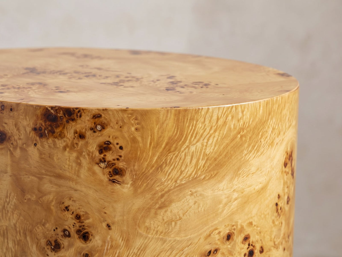 Close-up of the Scapoli Burl Veneer Oval Pillar Side Table: the crisp top edge of the oval burl pillar