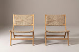 A Scopello lounge chair seen from the front: woven back, woven seat and low stretcher rails between the legs