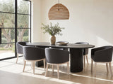 Seminara 80-Inch Oval Fluted Pedestal Dining Set with 6 Chairs in a sunlit villa dining area with olive trees outside
