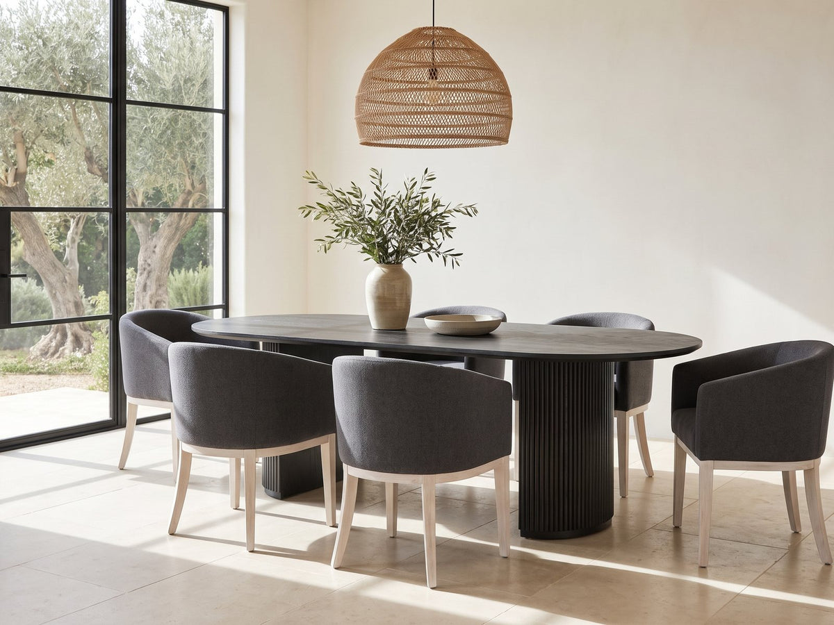 Seminara 80-Inch Oval Fluted Pedestal Dining Set with 6 Chairs in a sunlit villa dining area with olive trees outside