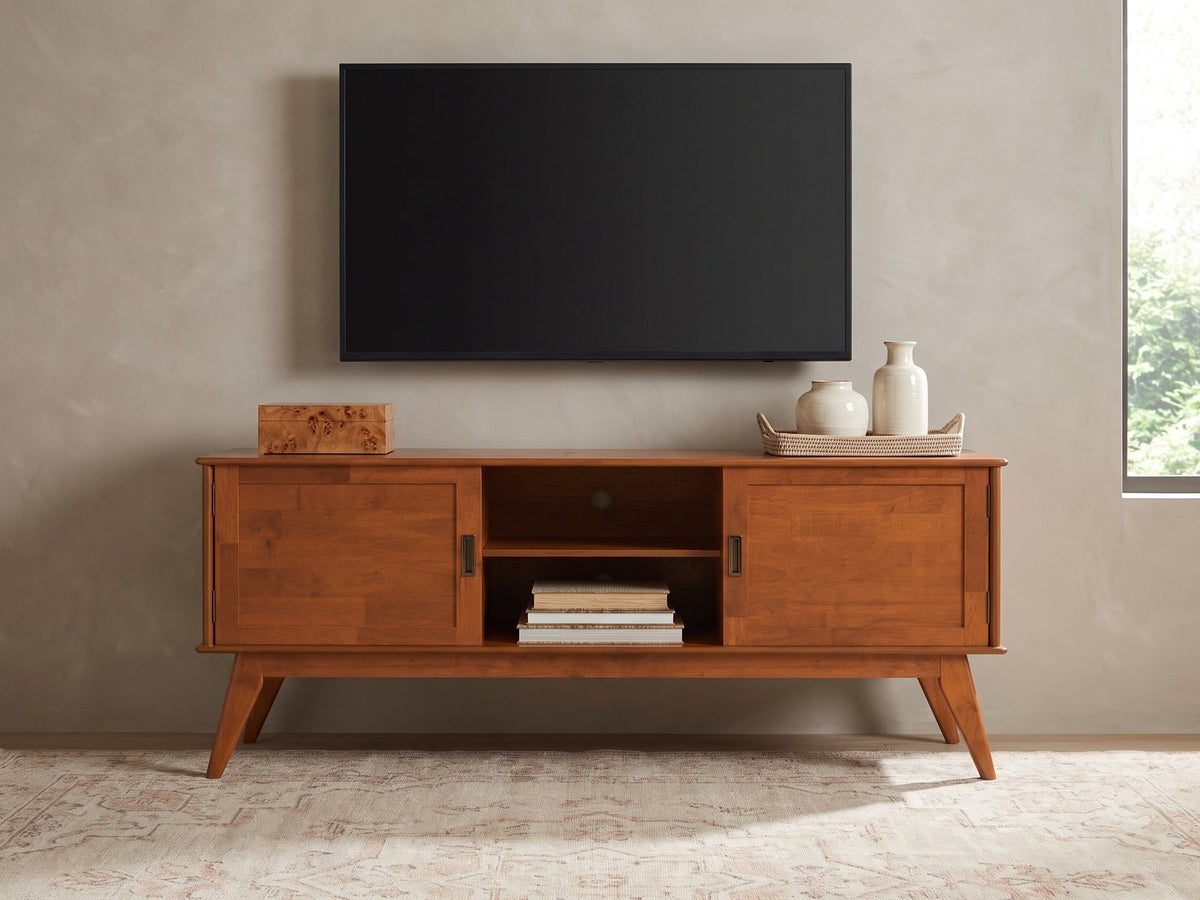 Senigallia Low Mid-Century Media Console styled with a box, a tray of vases and books under a wall-mounted screen