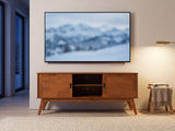 Senigallia Low Mid-Century Media Console under a screen showing a snowy landscape on a winter evening