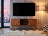 Senigallia Low Mid-Century Media Console under a wall-mounted screen in an alpine chalet at dusk