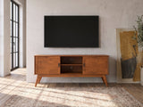 Senigallia Low Mid-Century Media Console under a wall-mounted screen in an industrial loft