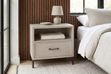 Sennori cerused oak nightstand against walnut slat panelling in a Hudson Valley bedroom with a black steel window