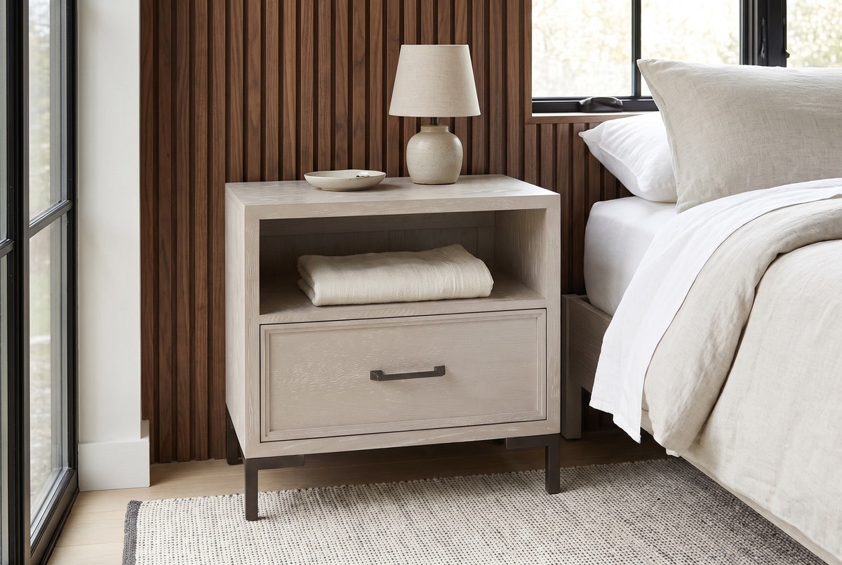 Sennori cerused oak nightstand against walnut slat panelling in a Hudson Valley bedroom with a black steel window