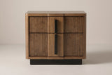 The Senorbi nightstand in ash brown with reeded drawer fronts, front view on a light studio backdrop