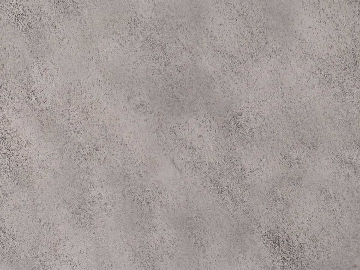 Close-up of the Sepino Antique Silver Metal Drum Side Table: the hammered antique silver finish of the top