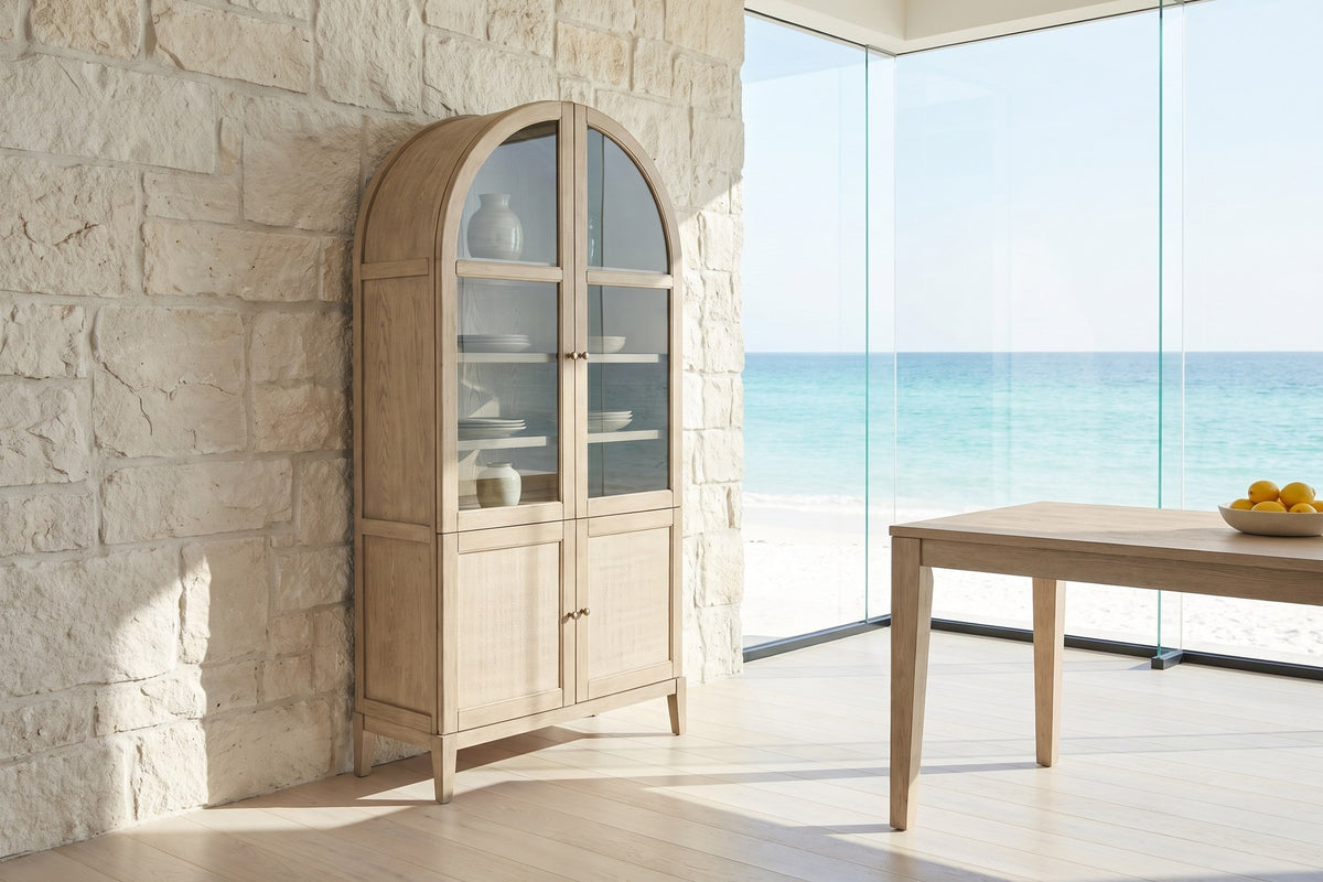 Serrastretta 42-Inch 4-Door Arched Oak Veneer Display Cabinet with Glass and Cane in an oceanfront glass house