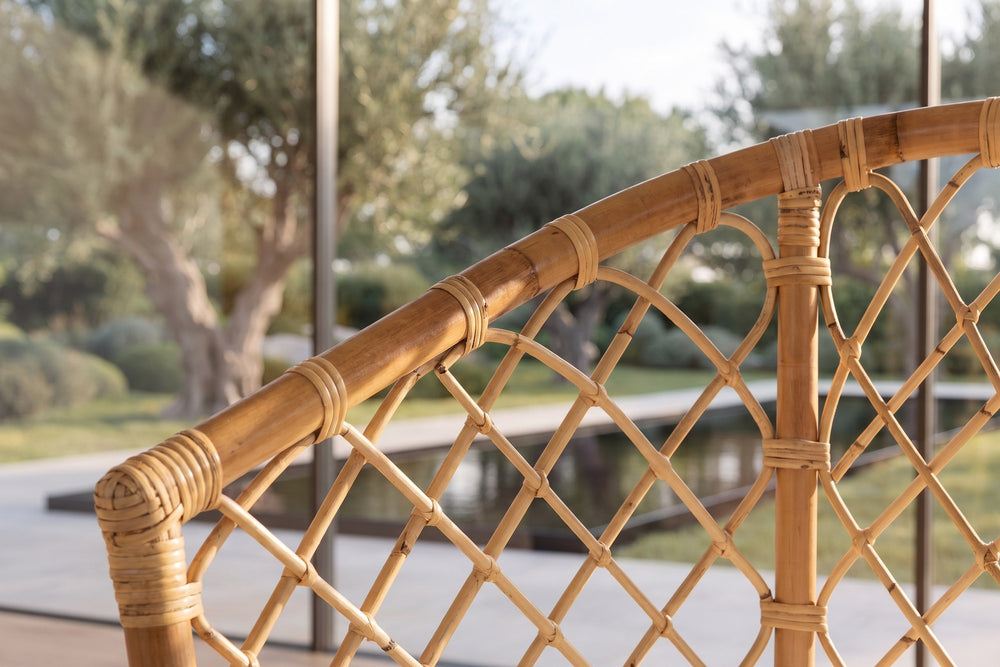 Close-up of the Sersale Natural Rattan Barrel-Back Dining Chair: lattice