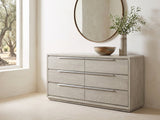 Sesto 63-Inch Gray Oak 6-Drawer Dresser under a round bronze mirror in a villa bedroom