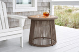 Siculiana rope side table with a pitcher of iced tea beside a white Adirondack chair on an Outer Banks beach house deck, a cedar shingle wall and dune grass beyond (chair and decor not included)