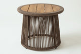 The Siculiana side table, three-quarter view: a round slatted acacia top in a thick rope rim over an open cone of dark beige rope, on a light studio backdrop